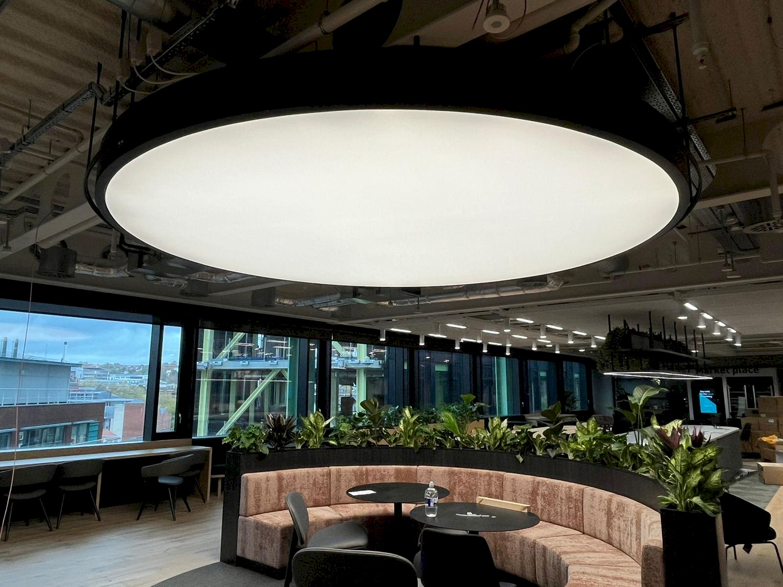 Bright meeting room with illuminated fabric ceilings