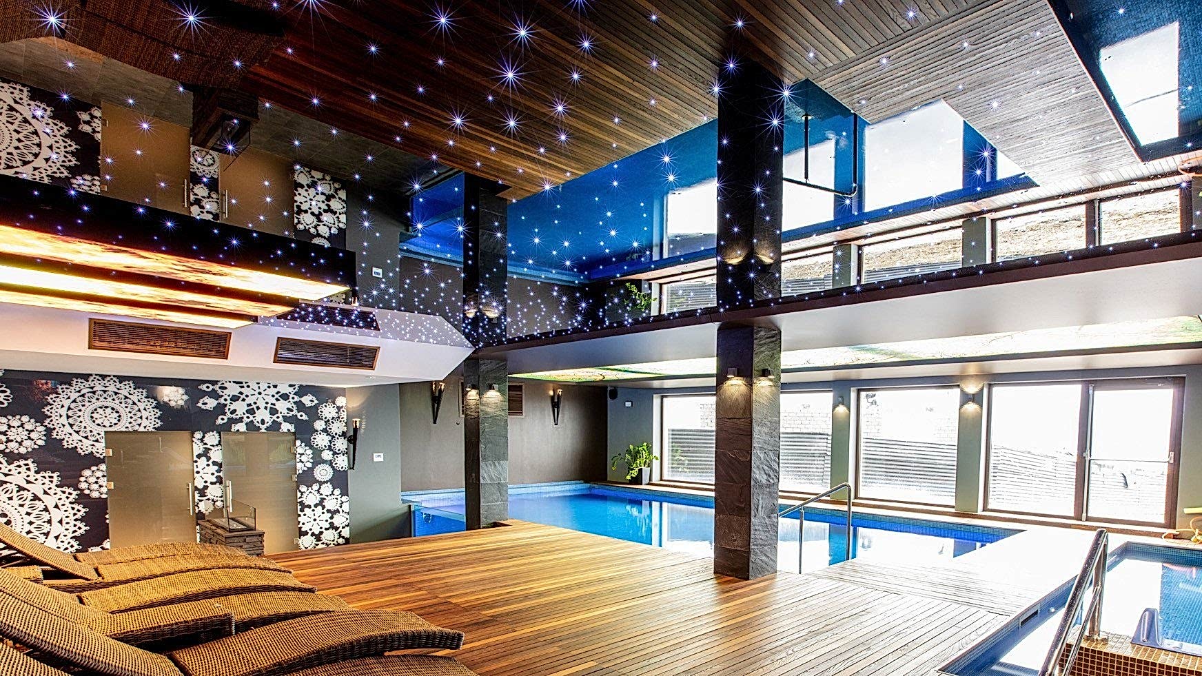Pool area with illuminated stretch ceiling