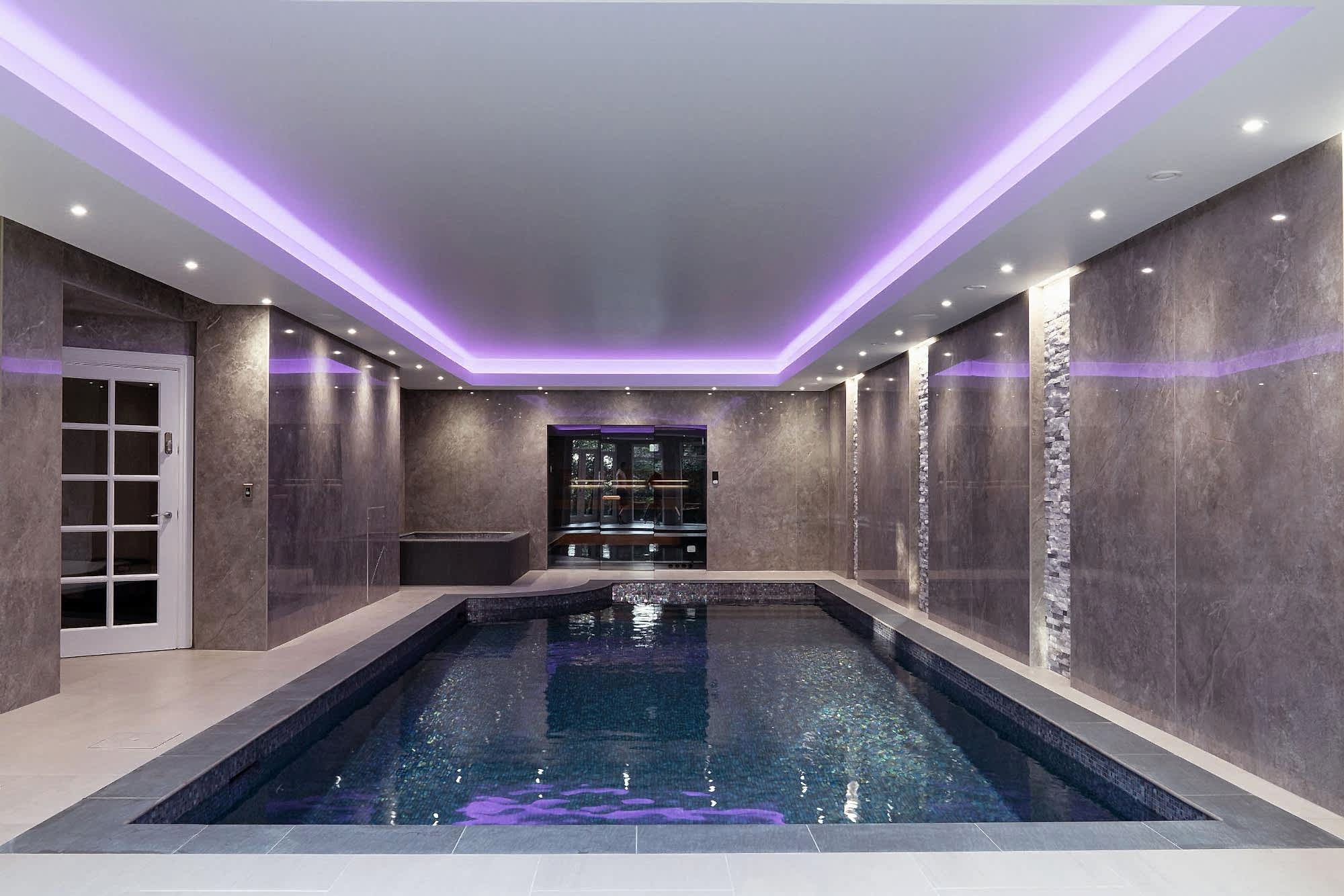 Pool area with illuminated stretched ceiling