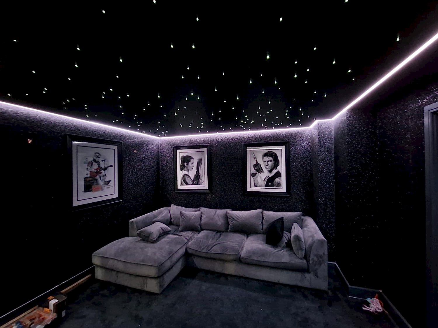 Dark room with star illuminated ceiling